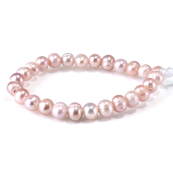 This is a Dakota Stones 8-9mm Freshwater Pearl Pink Purple Potato Gemstone strand of round beads in 8 inch strand.