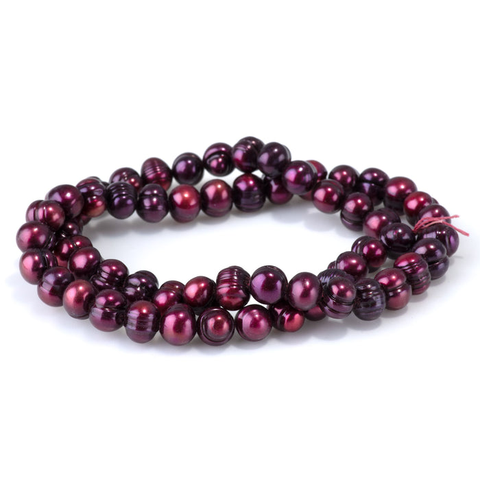 This is a Dakota Stones 8-9mm Freshwater Pearl Purple Pink Potato Gemstone strand of round beads in 15-16 inch strand.