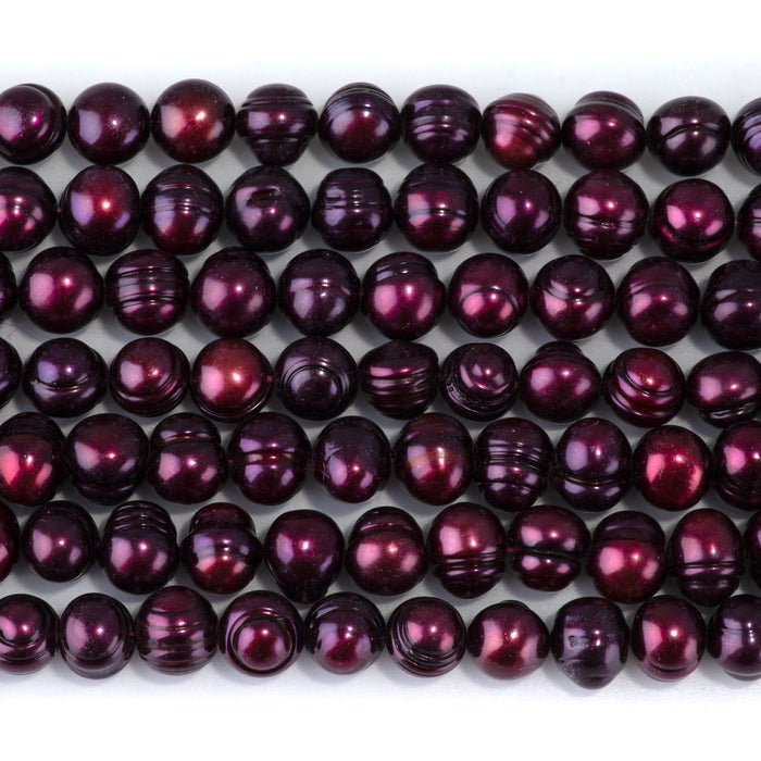 This is a Dakota Stones 8-9mm Freshwater Pearl Purple Pink Potato Gemstone strand of round beads in 15-16 inch strand.