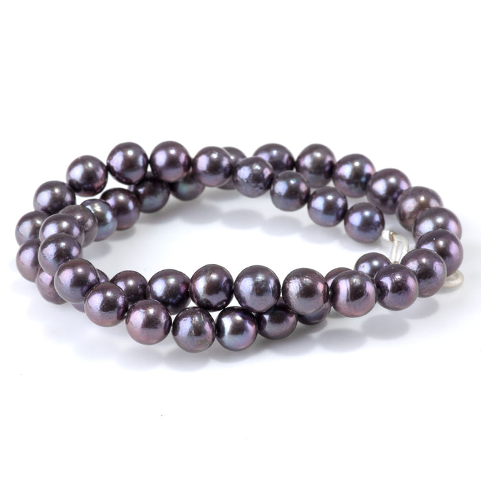 This is a Dakota Stones 9-10mm Freshwater Pearl Peacock Edison Gemstone strand with round beads in 15-16 inch strand.