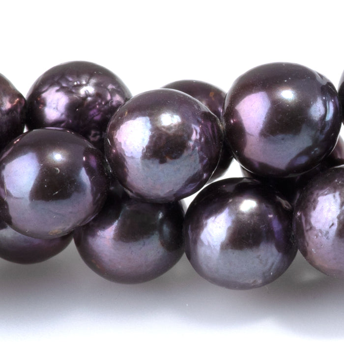 This is a Dakota Stones 9-10mm Freshwater Pearl Peacock Edison Gemstone strand with round beads in 15-16 inch strand.