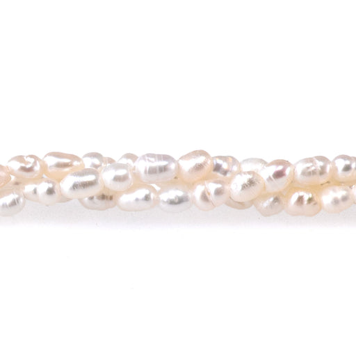 This is a Dakota Stones 2-3mm Freshwater Pearl White Rice Gemstone strand of round beads in 15-16 inch strand.
