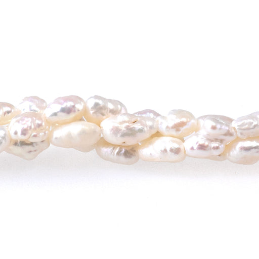 This is a Dakota Stones 3-5mm Freshwater Pearl White Crispy Rice Gemstone strand of round beads in 15-16 inch strand.