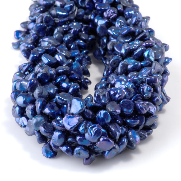This is a Dakota Stones 5-8mm Special Price Freshwater Pearl strand with blue keshi beads in 15-16 inch strand.