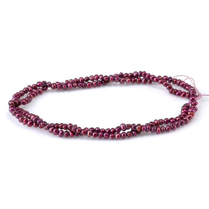 This is a Dakota Stones 5-3mm Freshwater Pearl Dark Pink Potato Gemstone strand of round beads in 15-16 inch strand.