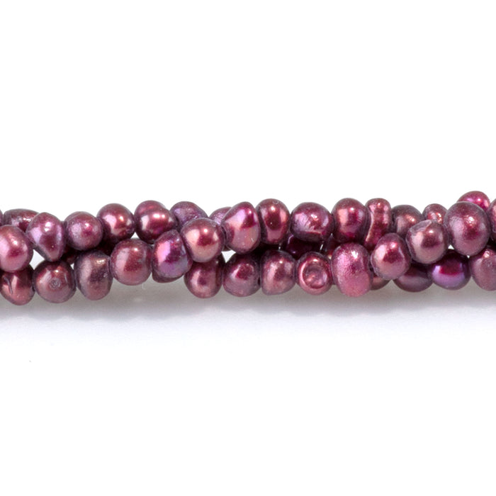 This is a Dakota Stones 5-3mm Freshwater Pearl Dark Pink Potato Gemstone strand of round beads in 15-16 inch strand.