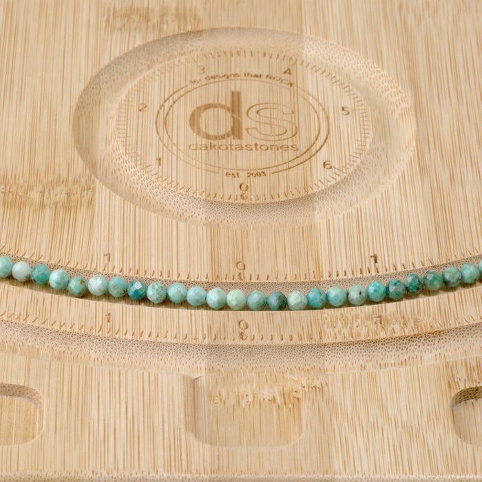 This is a Dakota Stones 4mm Peruvian Turquoise Gemstone strand with A grade faceted round beads in 15-16 inch strand.