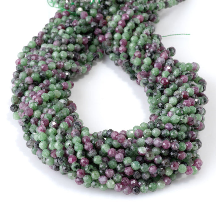 This is a Dakota Stones 4mm Ruby Zoisite Gemstone strand with faceted round beads in 15-16 inch strand.