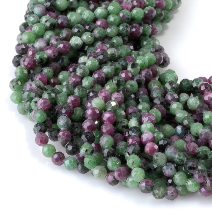 This is a Dakota Stones 4mm Ruby Zoisite Gemstone strand with faceted round beads in 15-16 inch strand.