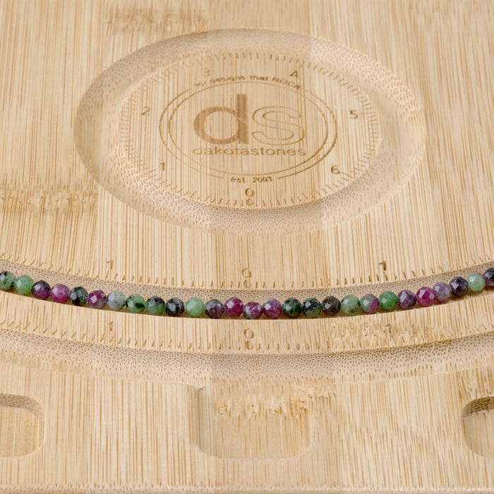 This is a Dakota Stones 4mm Ruby Zoisite Gemstone strand with faceted round beads in 15-16 inch strand.