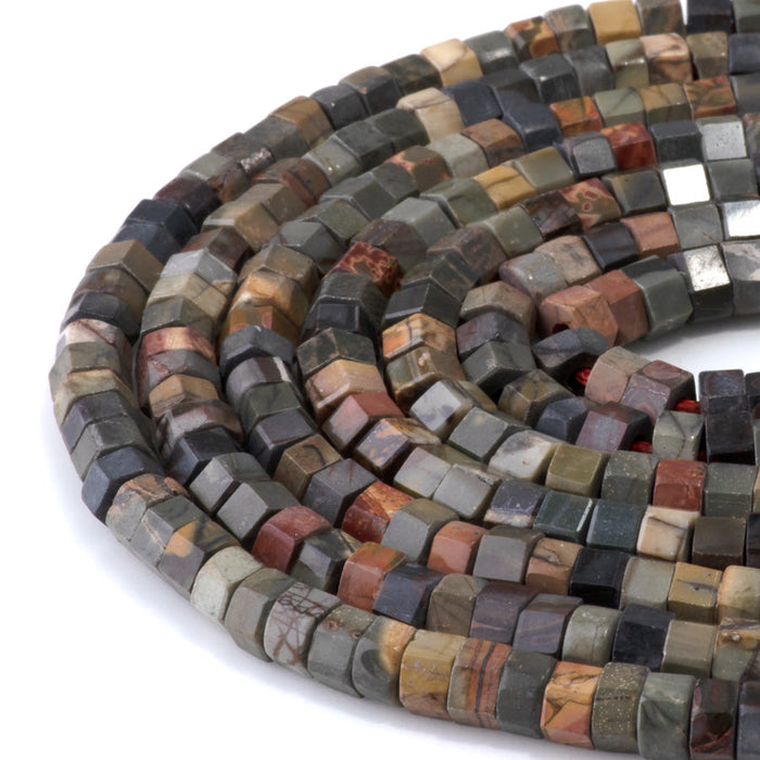 This is a Dakota Stones 6mm Red Creek Jasper Large Hole Gemstone strand with faceted hexagon beads in 8 inch strand.