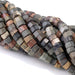 This is a Dakota Stones 6mm Red Creek Jasper Large Hole Gemstone strand with faceted hexagon beads in 8 inch strand.