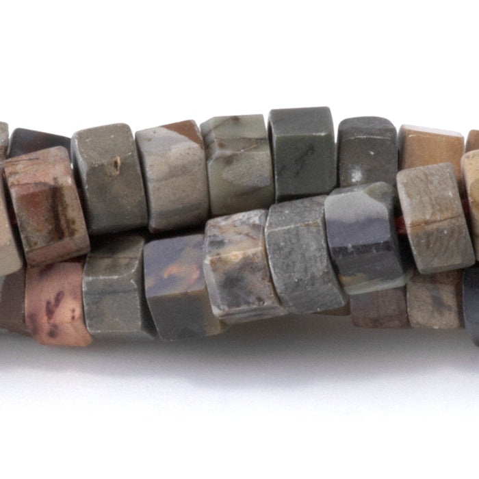 This is a Dakota Stones 6mm Red Creek Jasper Large Hole Gemstone strand with faceted hexagon beads in 8 inch strand.