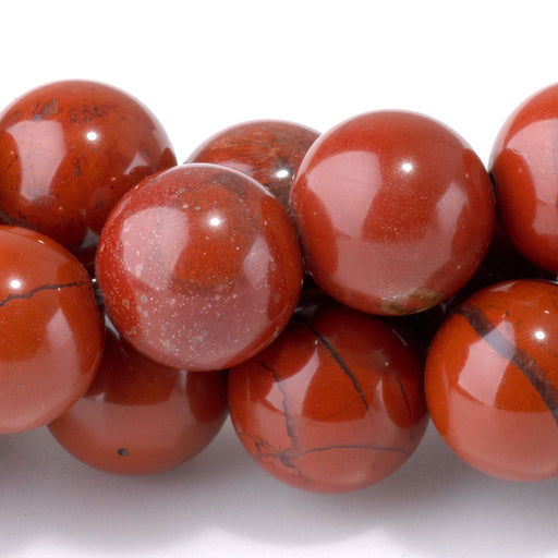 This is a Dakota Stones 10mm Red Jasper Gemstone strand with round beads in 15-16 inch strand.
