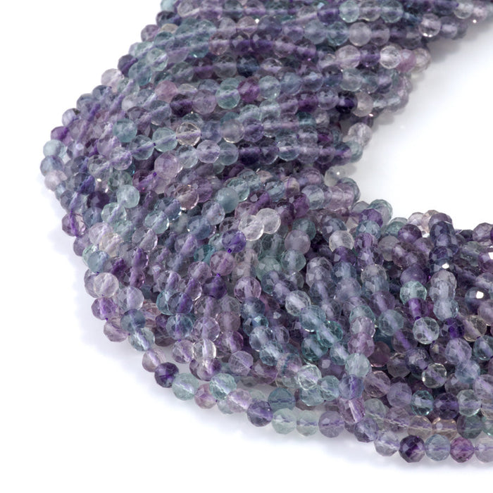 This is a Dakota Stones 4mm Rainbow Fluorite Gemstone strand with A grade microfaceted round beads in 15-16 inch strand.
