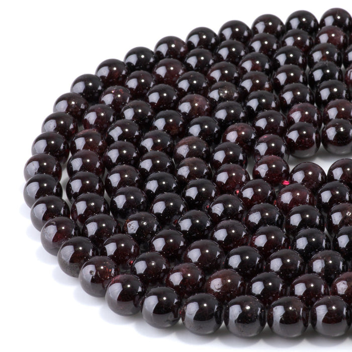 This is a Dakota Stones 10mm Red Garnet Gemstone strand with round beads in 15-16 inch strand.