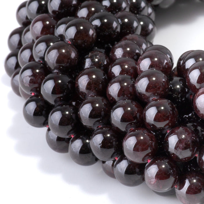 This is a Dakota Stones 10mm Red Garnet Gemstone strand with round beads in 15-16 inch strand.