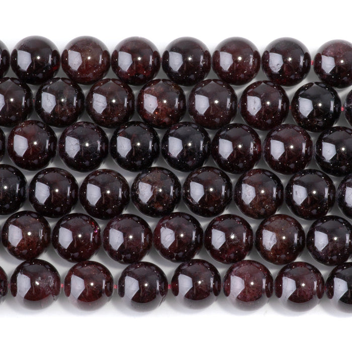 This is a Dakota Stones 10mm Red Garnet Gemstone strand with round beads in 15-16 inch strand.