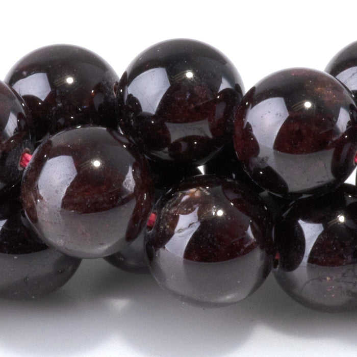 This is a Dakota Stones 10mm Red Garnet Gemstone strand with round beads in 15-16 inch strand.