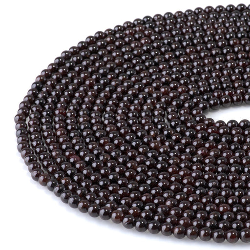 This is a Dakota Stones 4mm Red Garnet Gemstone strand with round beads in 15-16 inch strand.