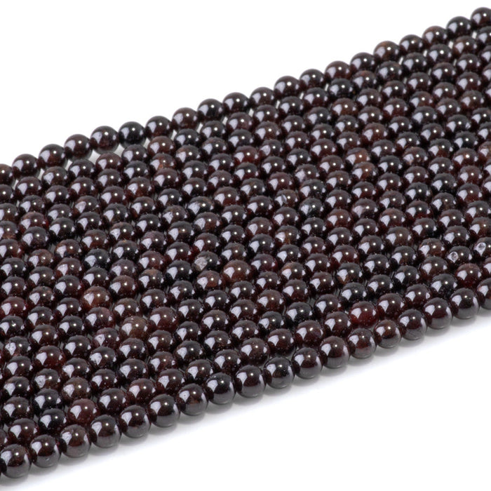 This is a Dakota Stones 4mm Red Garnet Gemstone strand with round beads in 15-16 inch strand.