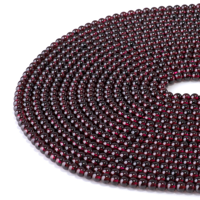 This is a Dakota Stones 4mm Red Garnet Gemstone strand with AA grade round beads in 15-16 inch strand.