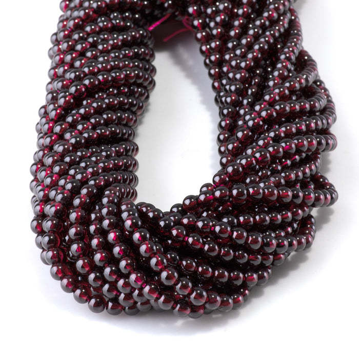 This is a Dakota Stones 4mm Red Garnet Gemstone strand with AA grade round beads in 15-16 inch strand.