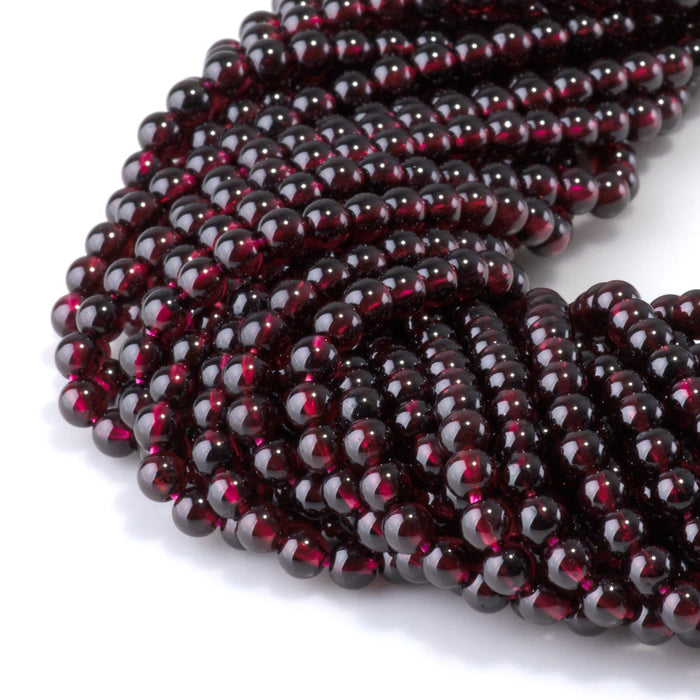 This is a Dakota Stones 4mm Red Garnet Gemstone strand with AA grade round beads in 15-16 inch strand.