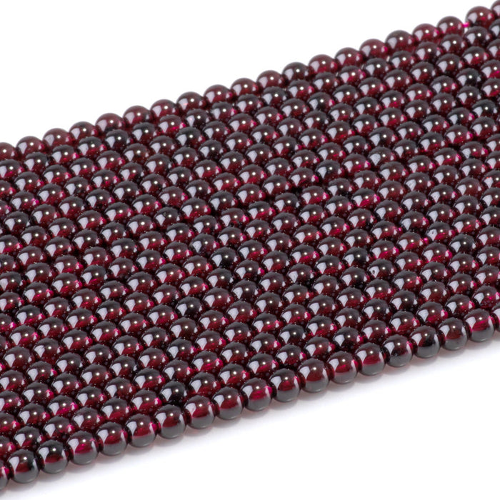This is a Dakota Stones 4mm Red Garnet Gemstone strand with AA grade round beads in 15-16 inch strand.