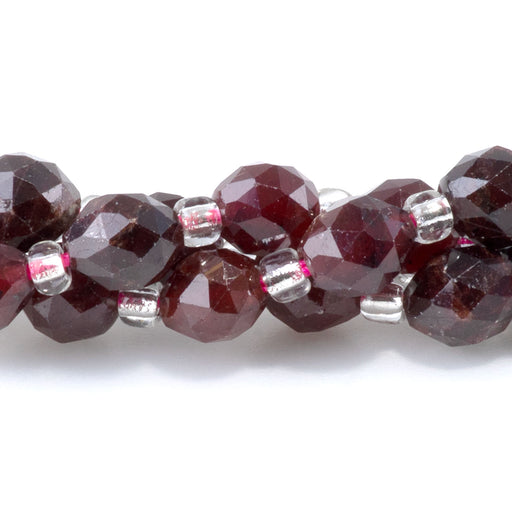 This is a Dakota Stones 4x6mm Red Garnet Triangle Cut Rice Gemstone strand with faceted beads in 15-16 inch strand.