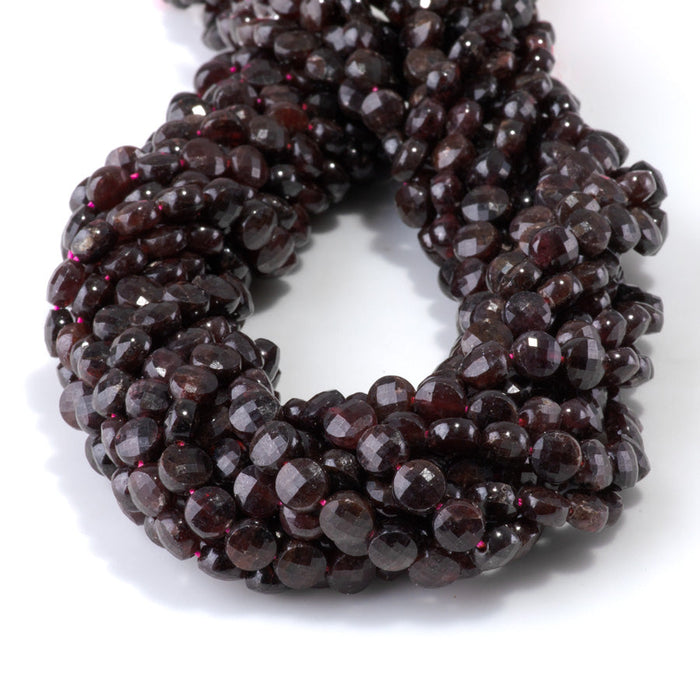 This is a Dakota Stones 6mm Red Garnet Gemstone strand with faceted coin beads in 15-16 inch strand.