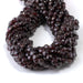 This is a Dakota Stones 6mm Red Garnet Gemstone strand with faceted coin beads in 15-16 inch strand.