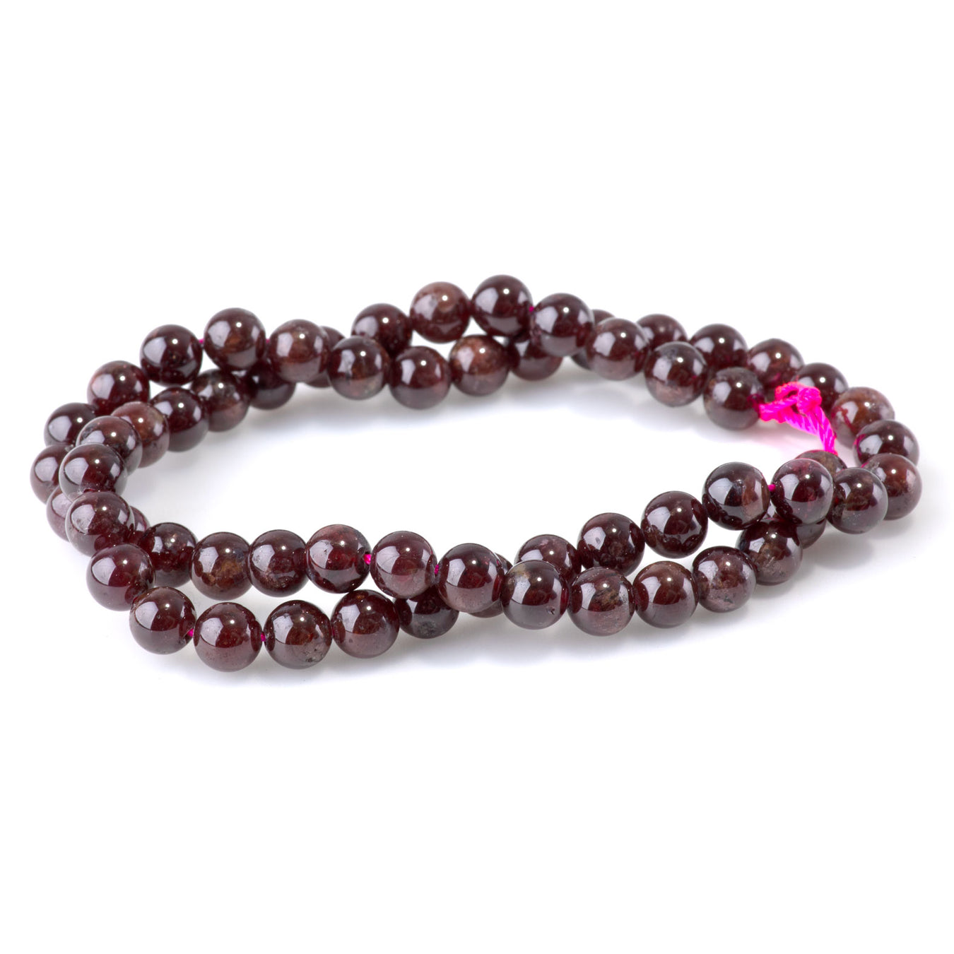 This is a Dakota Stones 6mm Red Garnet Gemstone strand with round beads in 15-16 inch strand.