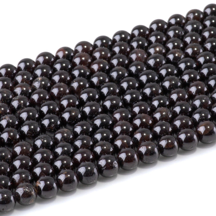 This is a Dakota Stones 6mm Red Garnet Gemstone strand with round beads in 15-16 inch strand.