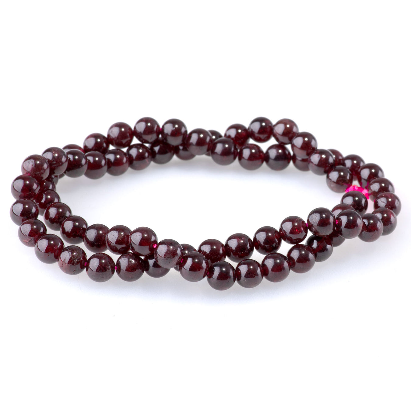 This is a Dakota Stones 6mm Red Garnet Gemstone strand with AA grade round beads in 15-16 inch strand.
