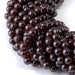 This is a Dakota Stones 6mm Red Garnet Gemstone strand with AA grade round beads in 15-16 inch strand.