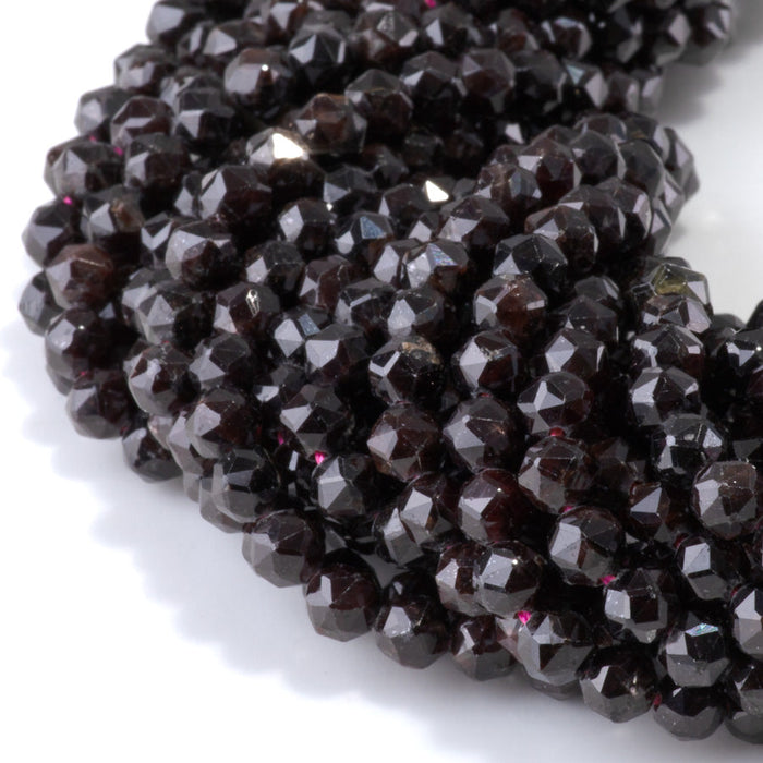 This is a Dakota Stones 6mm Red Garnet Gemstone strand with double heart faceted round beads in 15-16 inch strand.