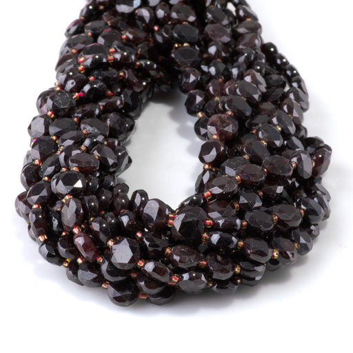 This is a Dakota Stones 8mm Red Garnet Cut Gemstone strand with coin star beads in 15-16 inch strand.
