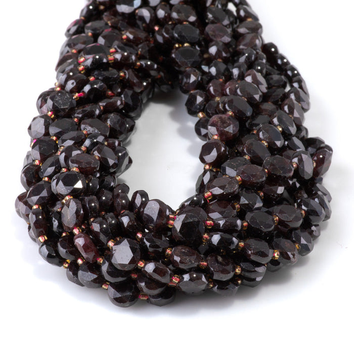 This is a Dakota Stones 8mm Red Garnet Cut Gemstone strand with coin star beads in 15-16 inch strand.