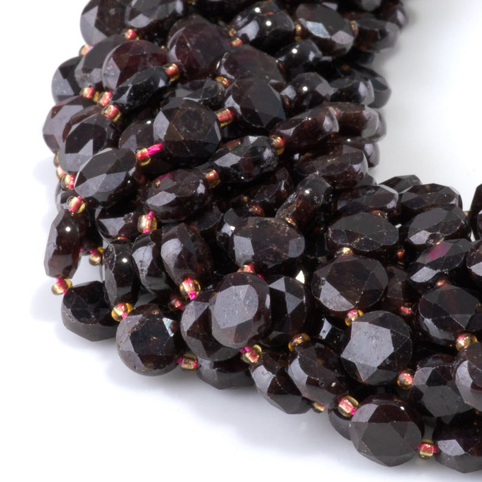 This is a Dakota Stones 8mm Red Garnet Cut Gemstone strand with coin star beads in 15-16 inch strand.
