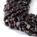 This is a Dakota Stones 8mm Red Garnet Cut Gemstone strand with coin star beads in 15-16 inch strand.