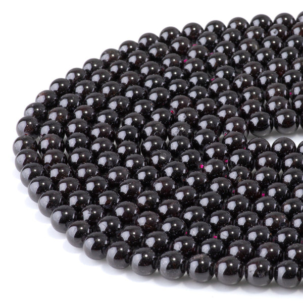 This is a Dakota Stones 8mm Red Garnet Gemstone strand with round beads in 15-16 inch strand.