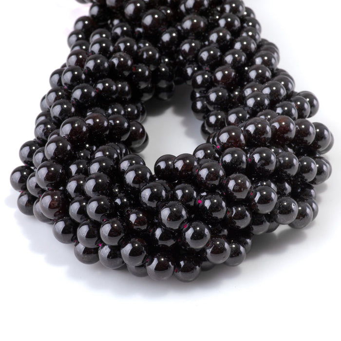 This is a Dakota Stones 8mm Red Garnet Gemstone strand with round beads in 15-16 inch strand.
