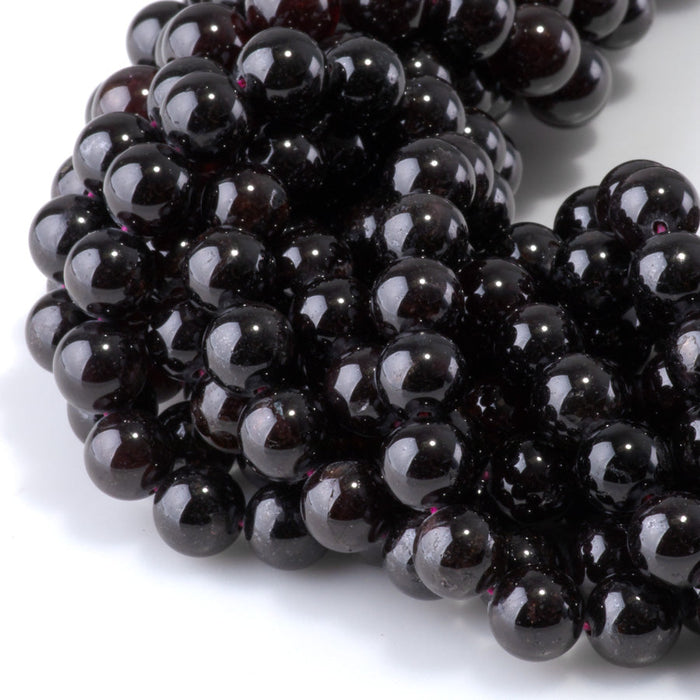 This is a Dakota Stones 8mm Red Garnet Gemstone strand with round beads in 15-16 inch strand.