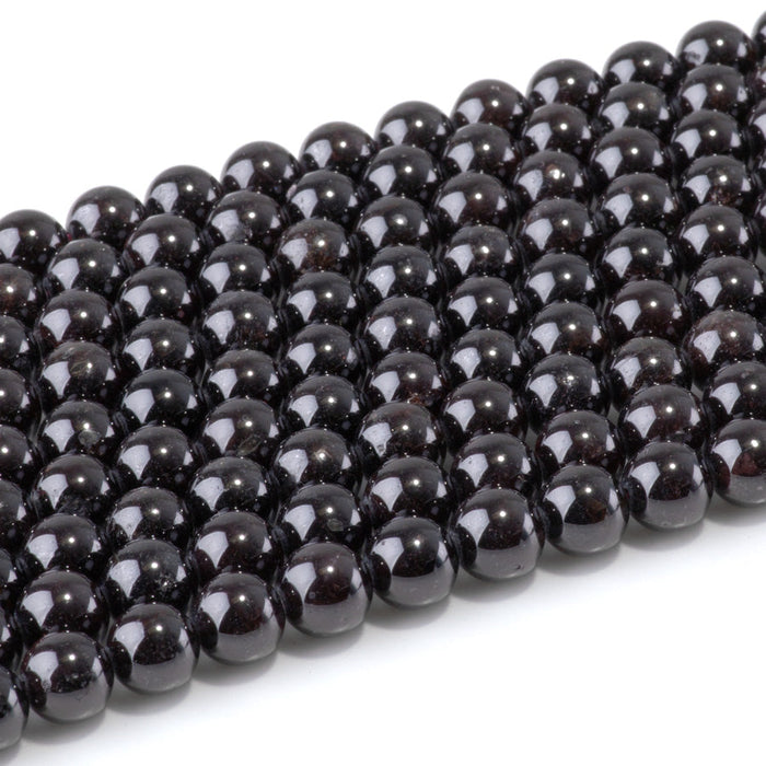 This is a Dakota Stones 8mm Red Garnet Gemstone strand with round beads in 15-16 inch strand.