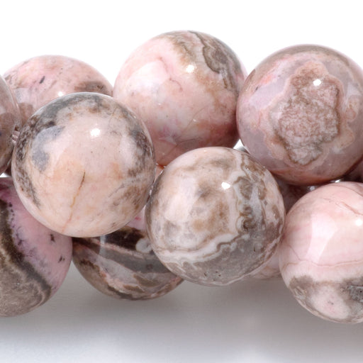 This is a Dakota Stones 10mm Peruvian Rhodochrosite Gemstone strand with round beads in 15-16 inch strand.