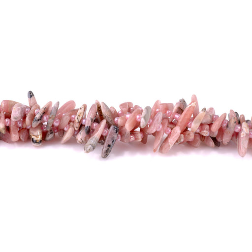 This is a Dakota Stones 5x10-20mm Rhodocrhosite Top Drill Teeth Gemstone strand of round beads in 15-16 inch strand.