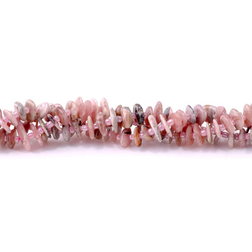 This is a Dakota Stones 5x8mm Rhodonite Gemstone strand with chip beads in 15-16 inch strand.