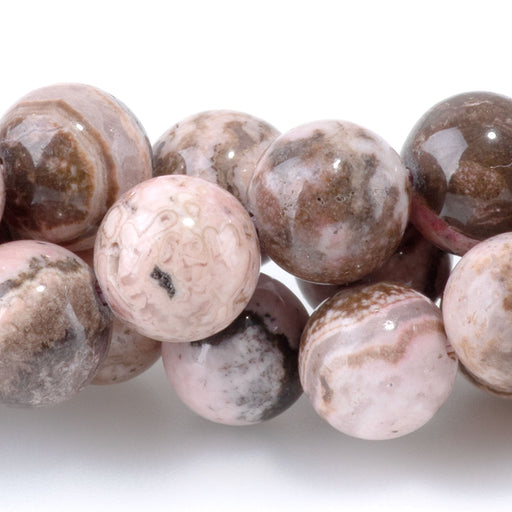 This is a Dakota Stones 8mm Peruvian Rhodochrosite Gemstone strand with round beads in 15-16 inch strand.