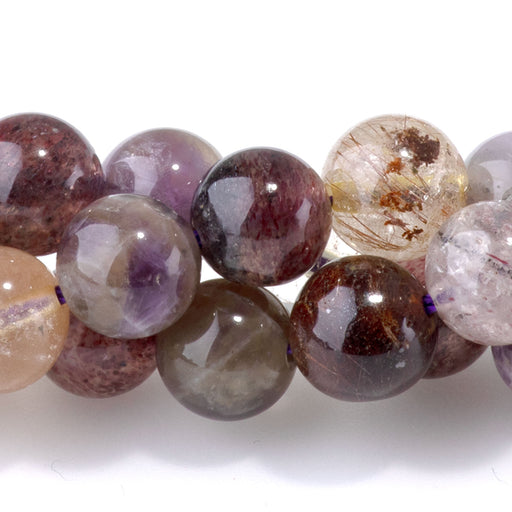 This is a Dakota Stones 8mm Rainbow Rutilated Quartz Gemstone strand with round beads in 15-16 inch strand.